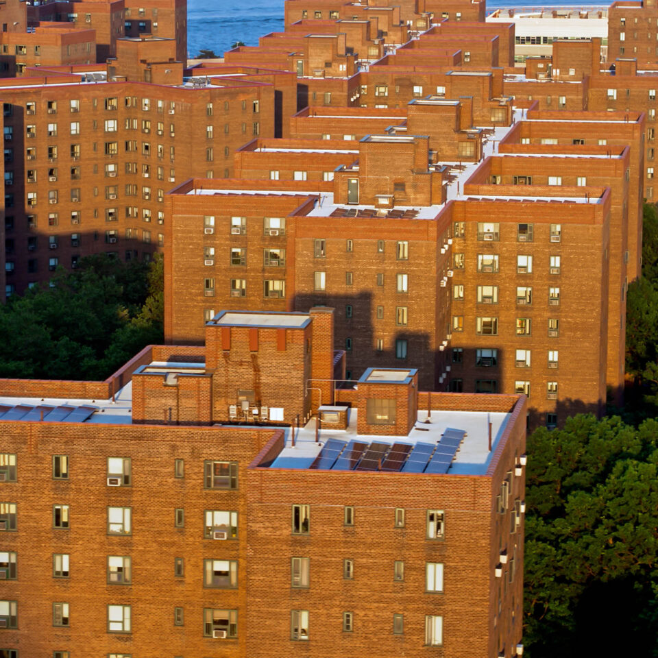 Aerial establishing shot of Stuyvesant Town-Peter Cooper Village on the east side of Manhattan on a sunny evening in summer.
