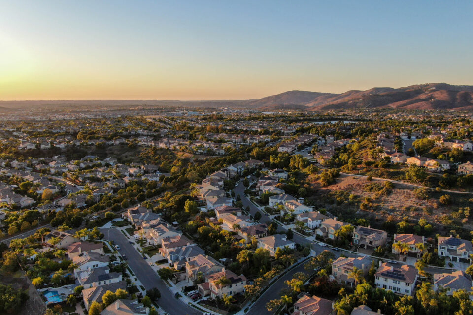 Aerial view of residential modern subdivision luxury house neighborhood during sunset. South California, USA