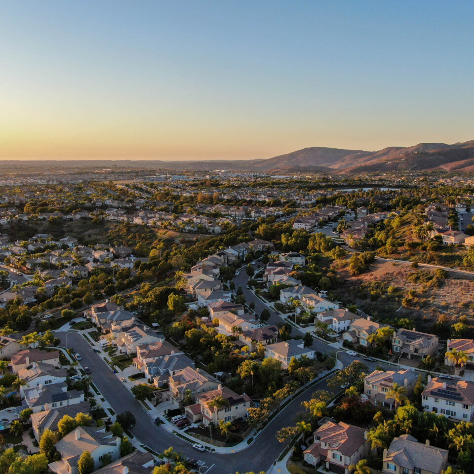 Aerial view of residential modern subdivision luxury house neighborhood during sunset. South California, USA