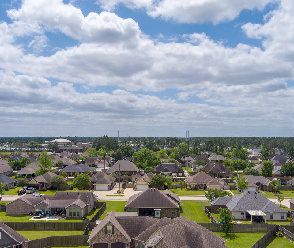 Aerial view of a neighborhood in Lumberton Texas with a overcast sky in late Springtime.